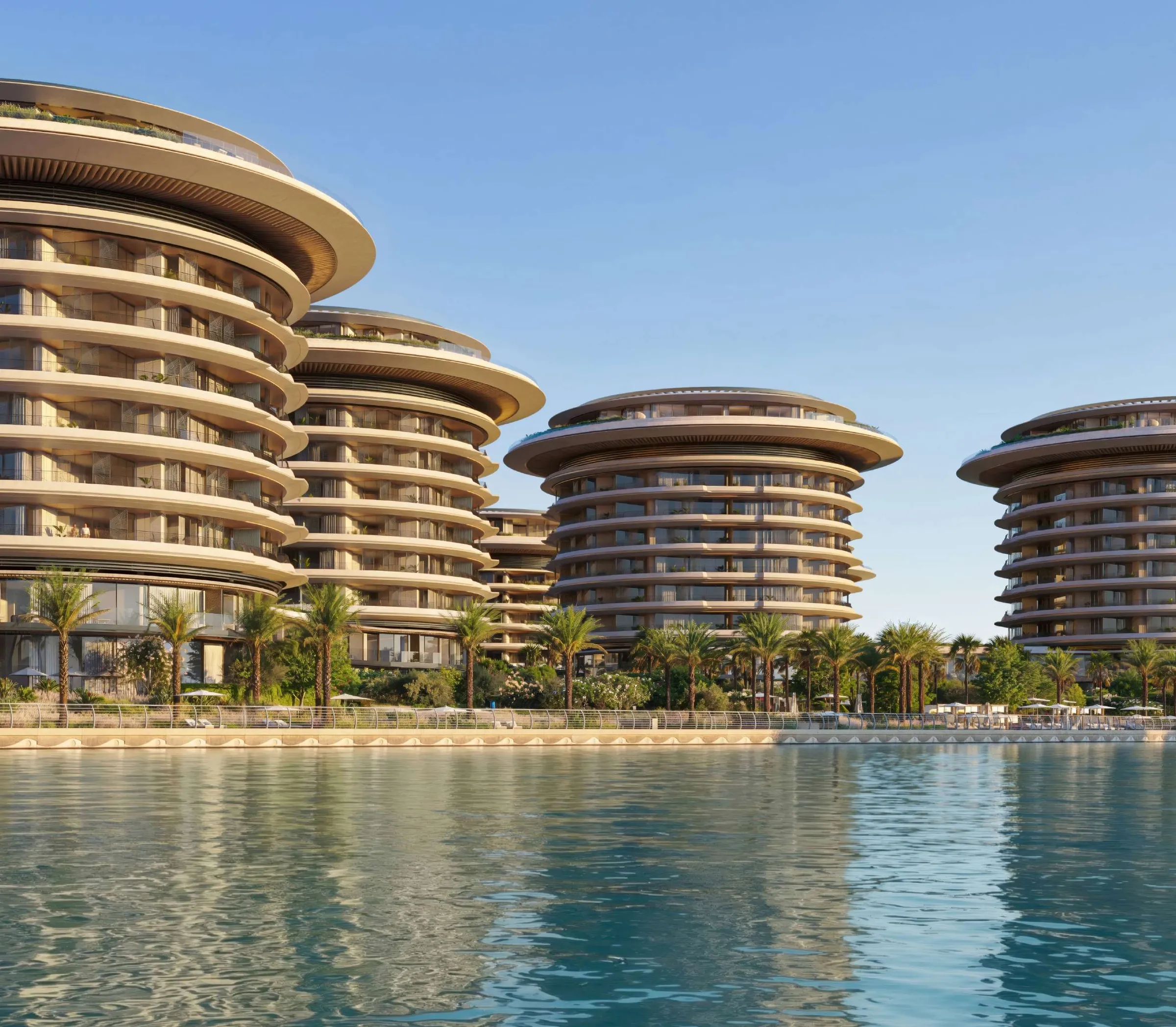 Render of the four curved low-rise towers of The Residences at The Dubai Beach EDITION seen from the water at Dubai Harbour