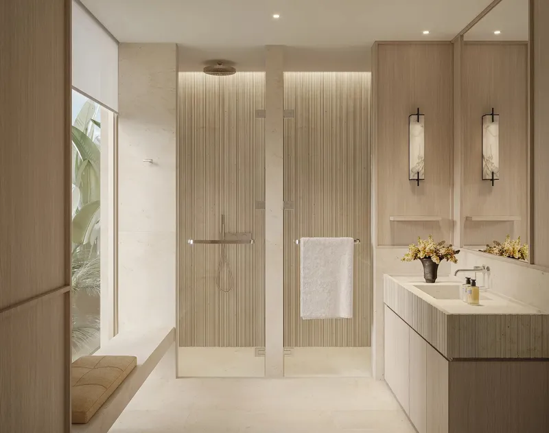 Bathroom of an Aurora villa at Eden Hills with a walk-in shower, stone vanity and window seat