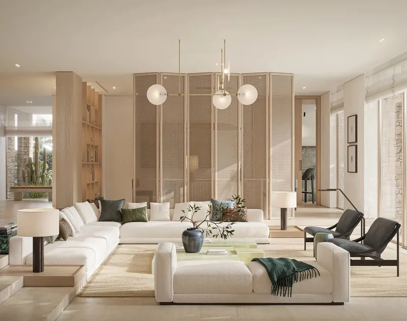 Living room of an Aurora villa at Eden Hills with pale stone floors, a large sofa and a timber screen