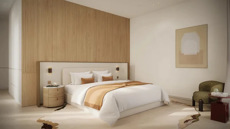 Main bedroom of an Eden House The Park apartment with a timber-slatted headboard wall