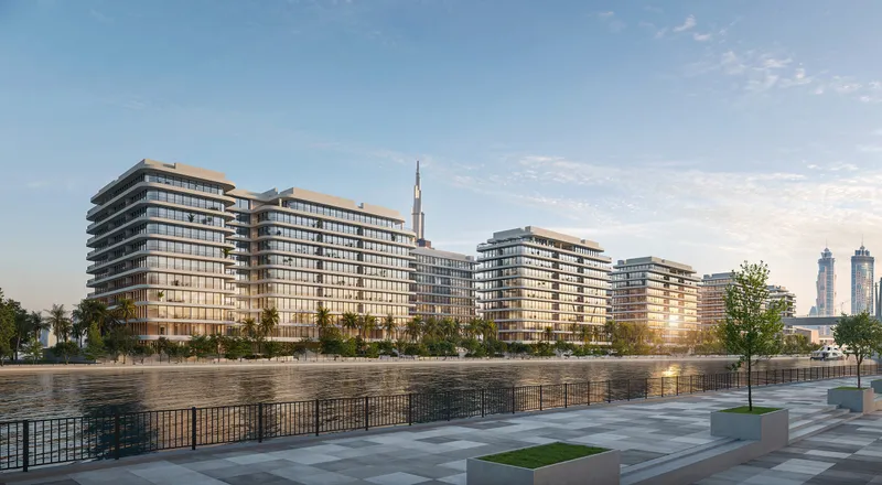 Render of the Eden House The Park buildings across the Dubai Water Canal at sunset, with Burj Khalifa behind