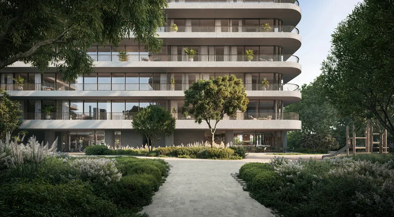 Curved balconies of an Eden House The Park building rising above planted gardens and a stone path