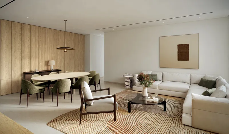 Living and dining room of an Eden House The Park apartment with a timber-panelled wall