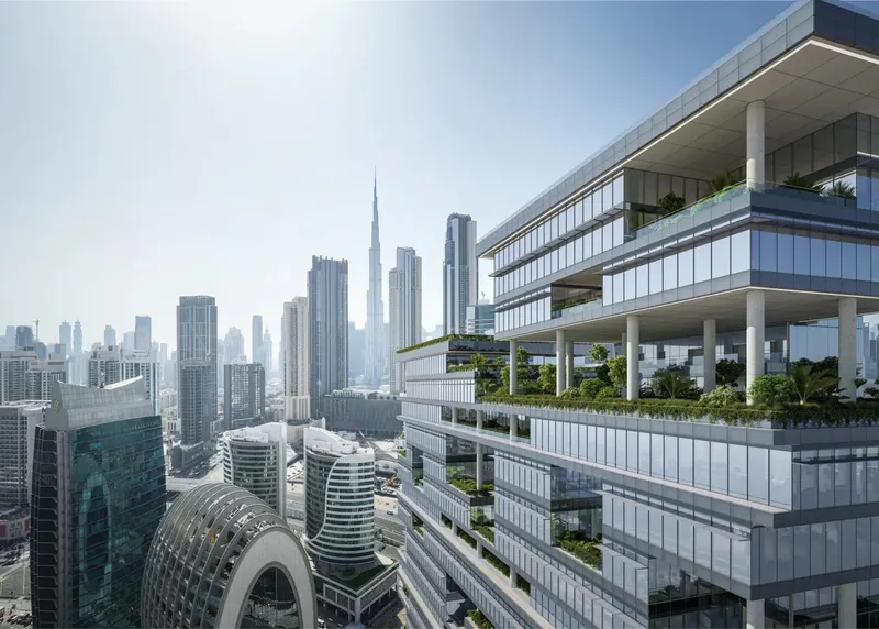 Render of ENARA's upper floors with landscaped terraces, looking towards Burj Khalifa and the Downtown Dubai skyline