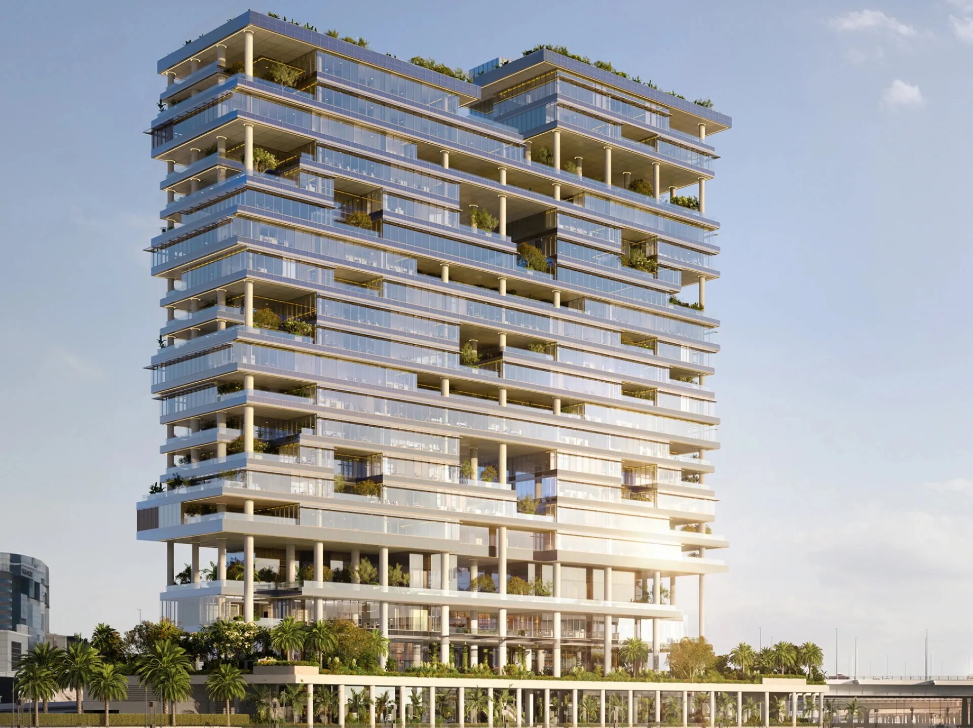 Render of the ENARA by OMNIYAT office tower with planted terraces on every level, above the Marasi Bay waterfront in Business Bay