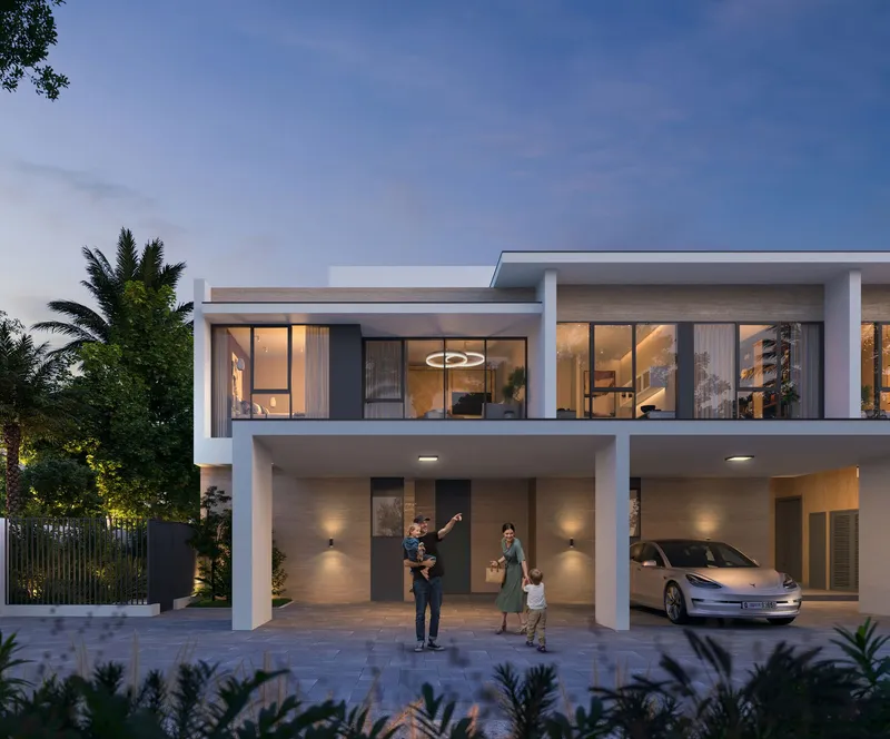 Front of an Equiterra townhouse with covered parking at dusk