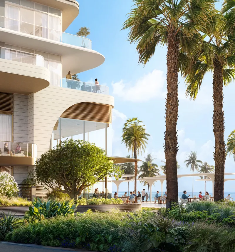 Render of the landscaped podium garden and curved terraces of a Fahid Beach Residences building, with a café terrace by the promenade