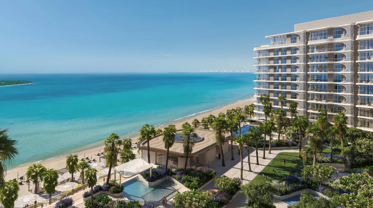 Render of a Fahid Beach Terraces building with curved balconies above landscaped gardens, a pool and the beach on Fahid Island