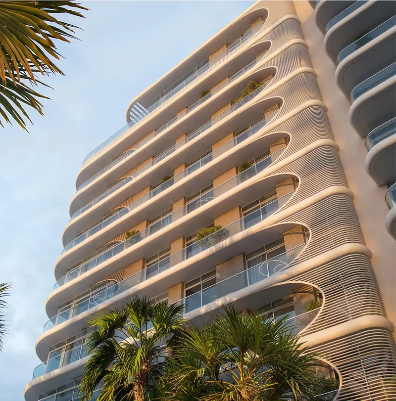 Render of a Fahid Beach Terraces facade with curved, ribbed balcony screens and planted terraces