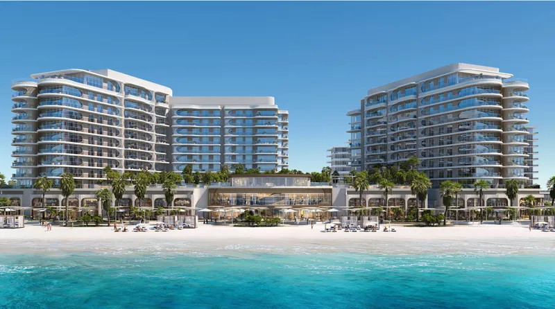 Render of the Fahid Beach Terraces buildings seen from the sea, with the clubhouse and beach loungers in front