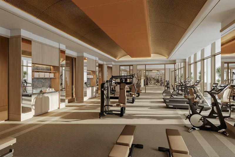 Render of the residents' gym at Four Seasons Private Residences Dubai at DIFC, with cardio machines and weights under a timber ceiling