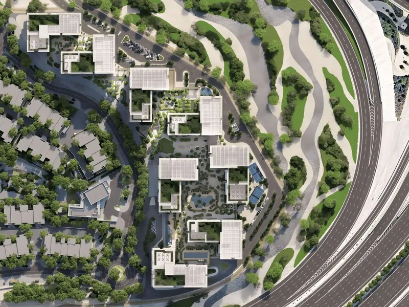 Top down site plan showing the apartment cluster between low rise housing and the adjacent highway