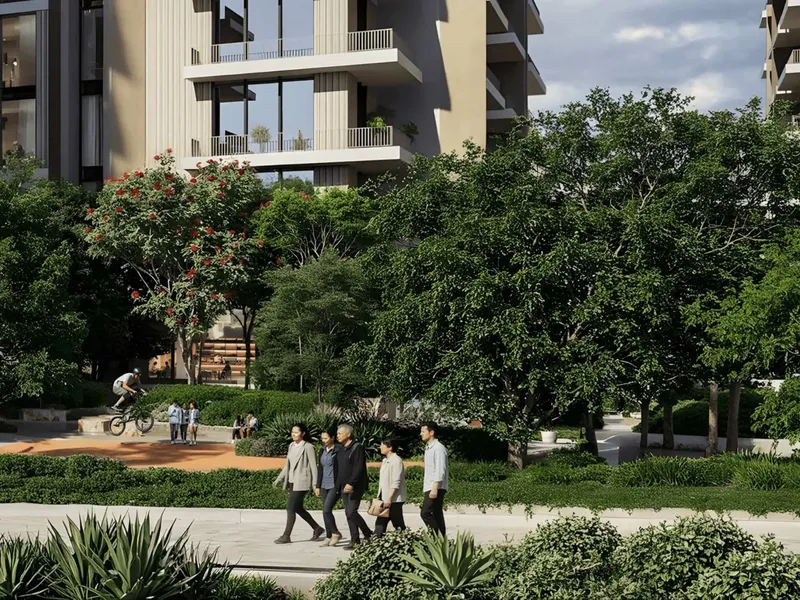 Landscaped walkway and pump track at the base of an Expo Valley Views residential block