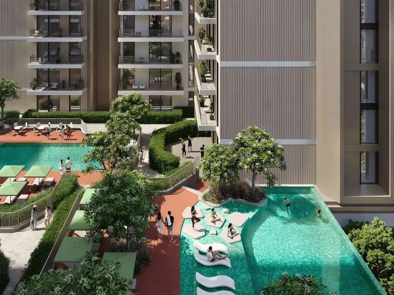 Two pools and shaded loungers in the landscaped deck between blocks at Expo Valley Views