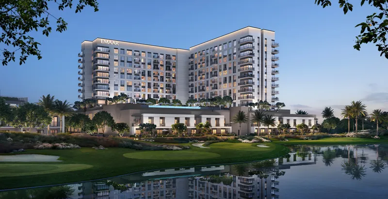 Render of the Golf Vale building at dusk reflected in a lake on the Emaar South golf course