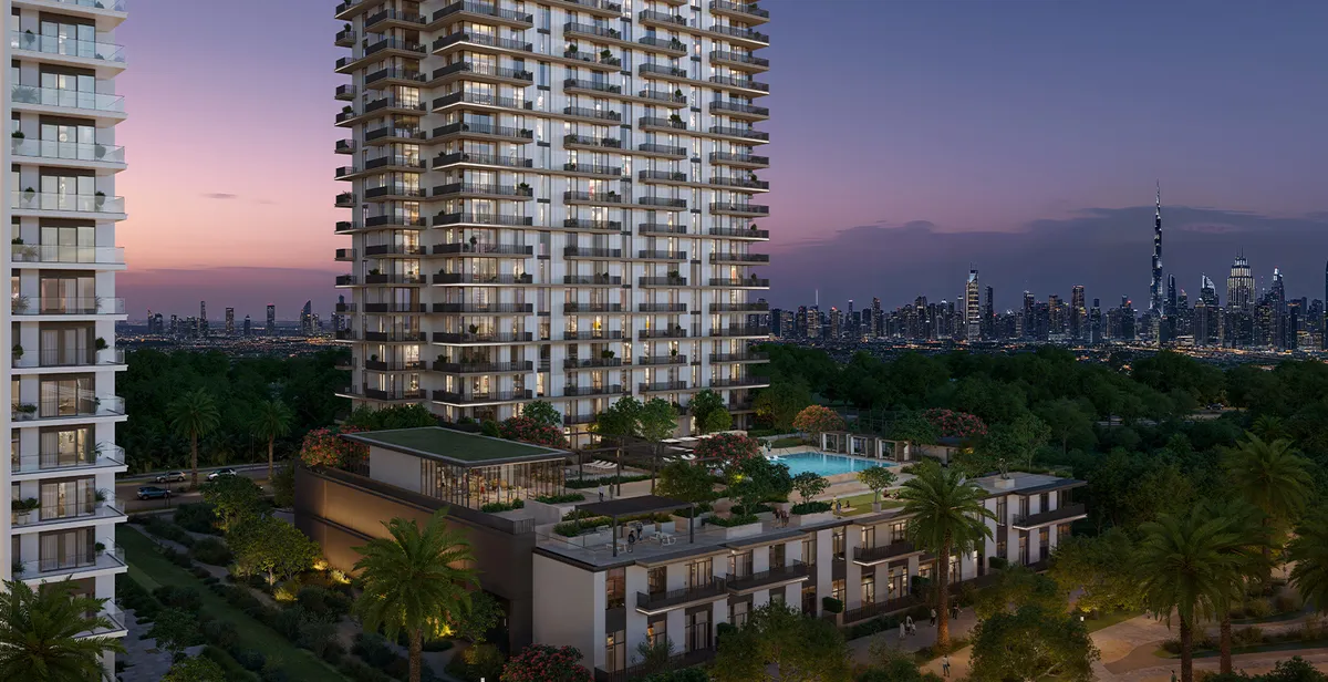 Render of the Greencrest tower at dusk above its landscaped podium, with the Downtown Dubai skyline in the distance