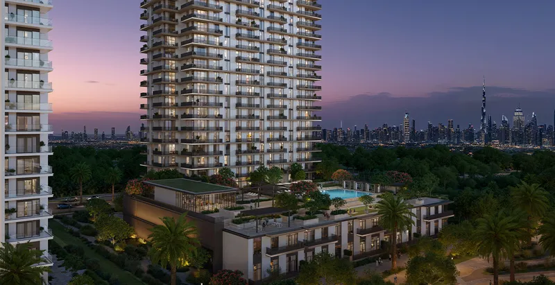 Render of the Greencrest tower at dusk above its landscaped podium, with the Downtown Dubai skyline in the distance