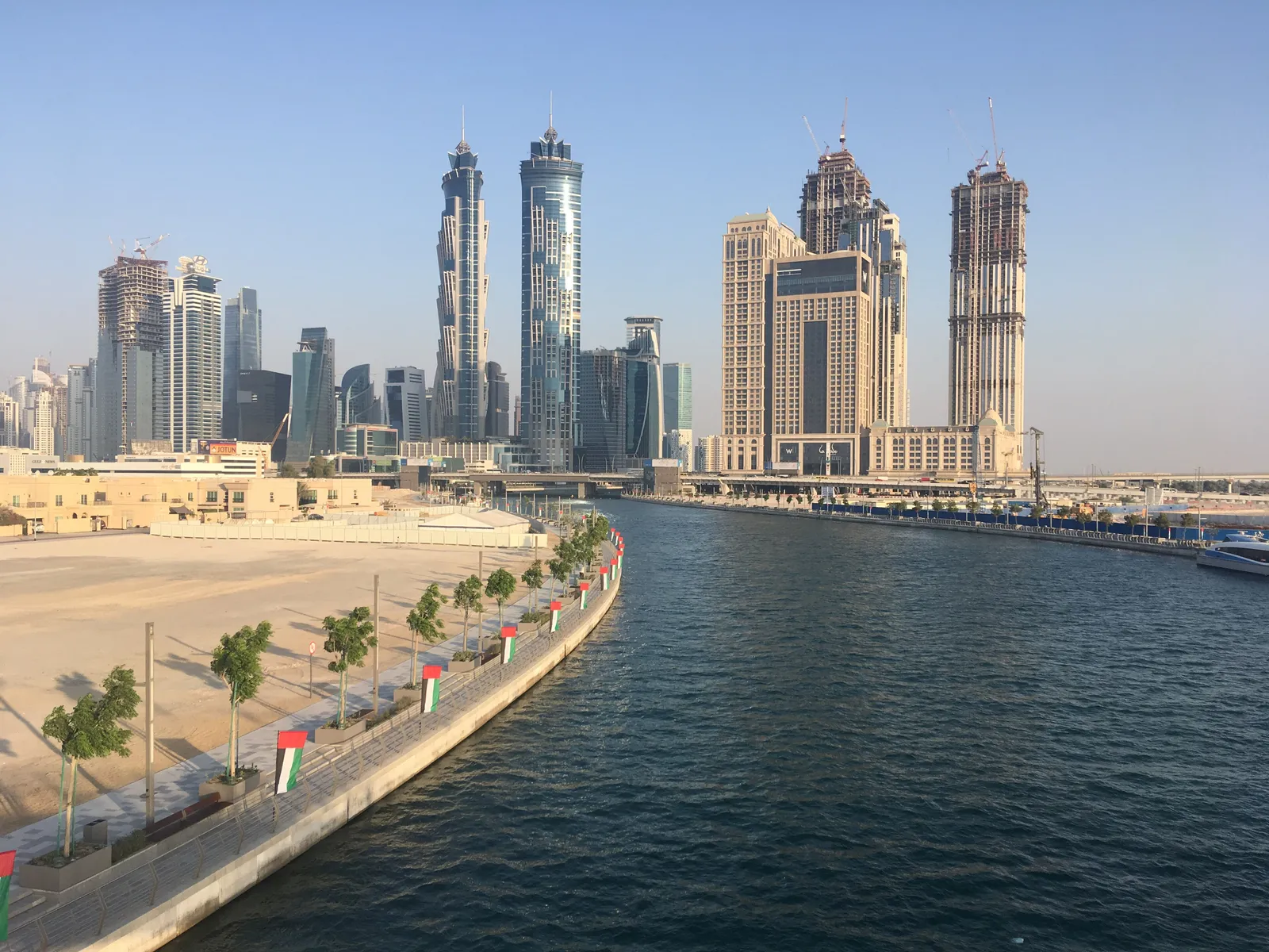 Business Bay towers along the Dubai Water Canal on a clear day