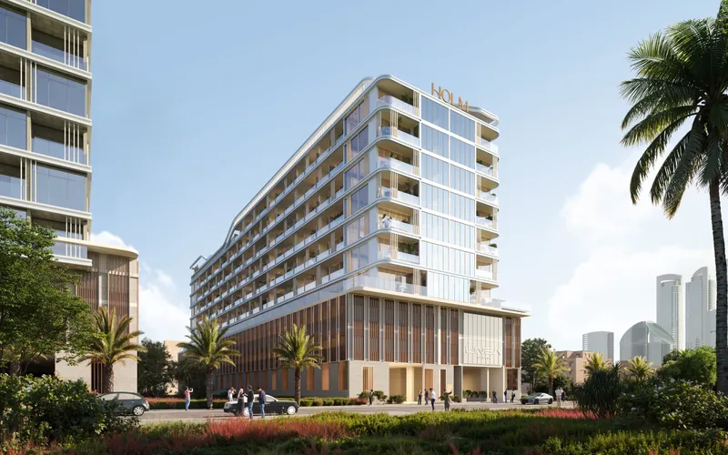 The low rise LINEA by HOLM building in Jumeirah Garden City, timber screened podium below curved white balconies