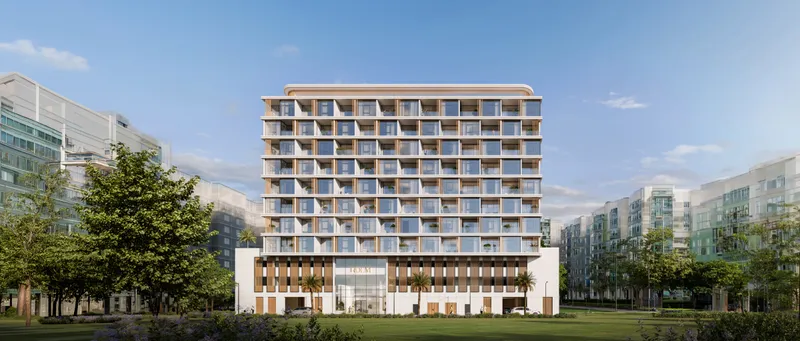 Front elevation of the HOLM One apartment building in Jumeirah Garden City, framed by trees