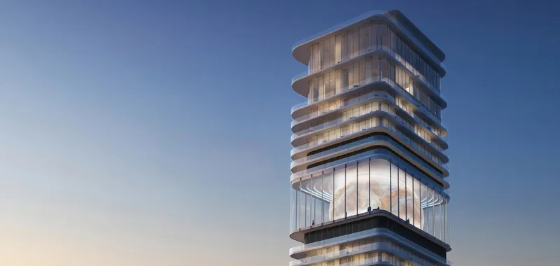 Render of the upper floors of Inaura Downtown with curved glass floor plates above the glazed orb level at dusk