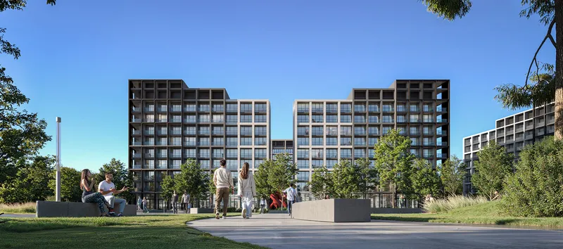 Render of the rear facades of the Jenna buildings at Aljada facing a landscaped park with a paved walkway and seating