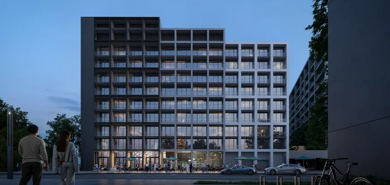 Dusk render of a Jenna apartment building at Aljada with lit windows and shopfronts at street level