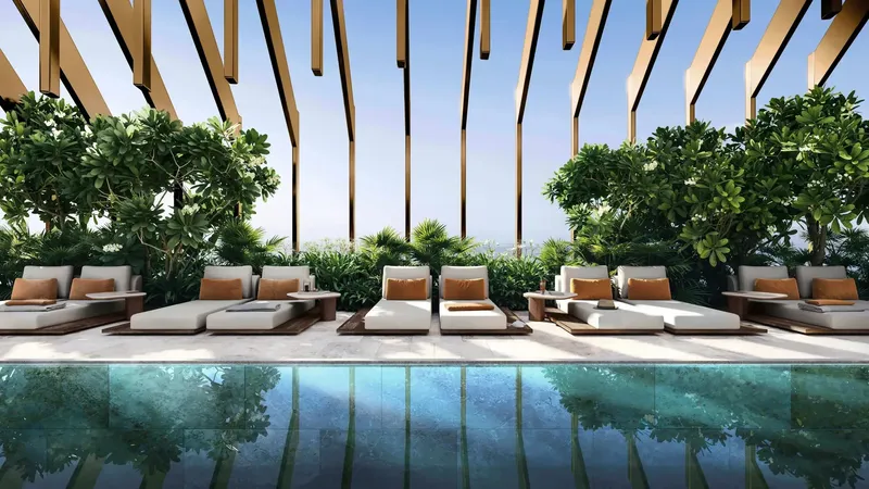 Swimming pool with loungers under a slatted canopy at Kanyon
