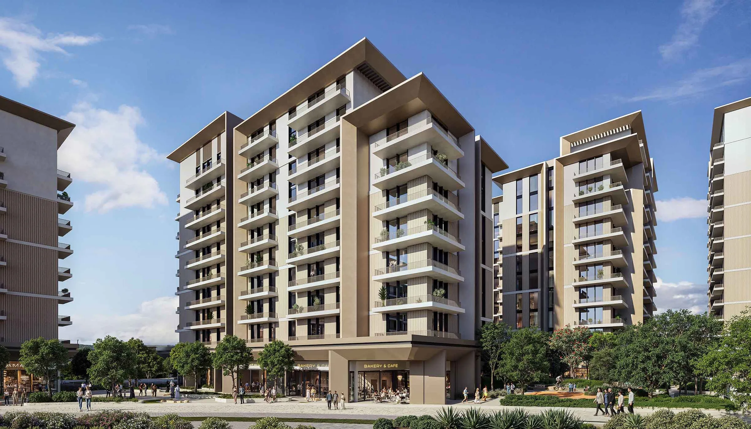 Street level view of an Expo Valley Views apartment building with a ground floor bakery and cafe