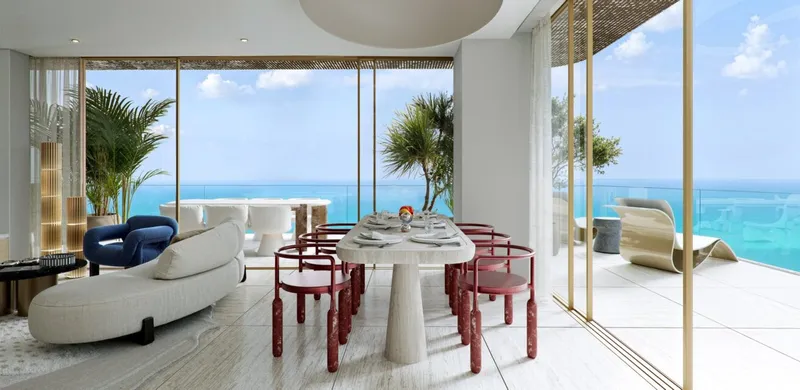 Living and dining room with sea views at Mondrian Al Marjan Island Beach Residences