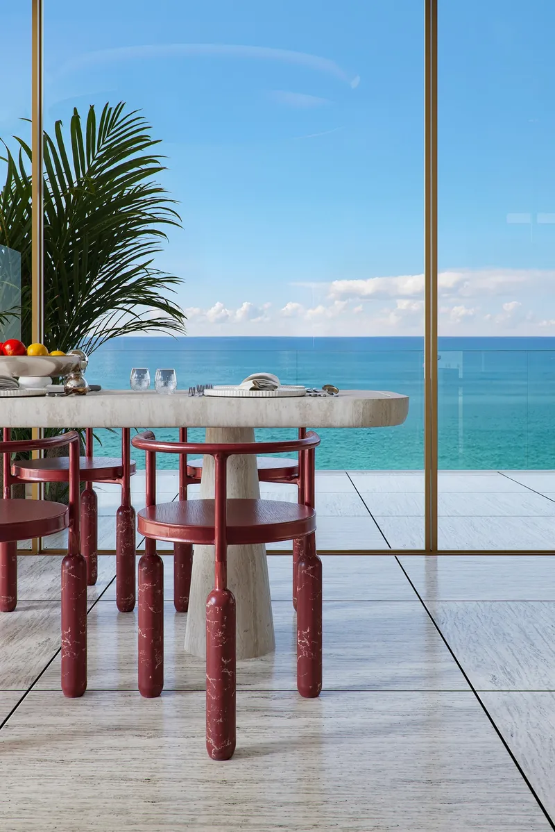 Terrace dining table with sea views at Mondrian Al Marjan Island Beach Residences