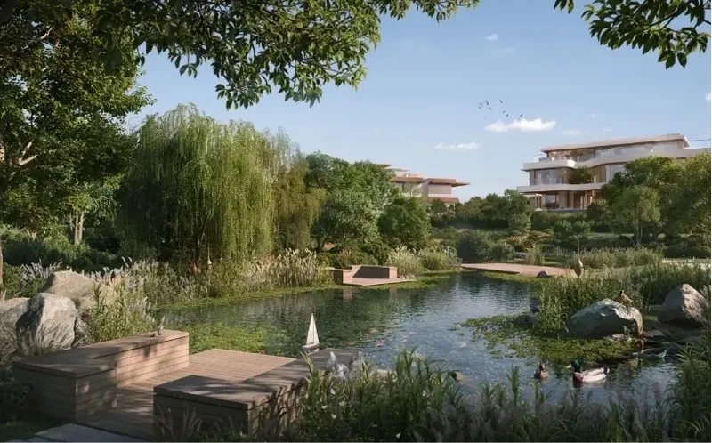 Render of Moringa mansions seen across a natural pond with reeds, willows and stepping blocks