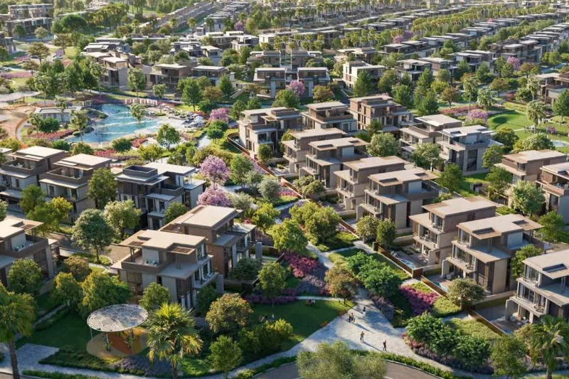 Aerial render of Nad Al Sheba Gardens villas with private pools arranged around the community lagoon and landscaped park