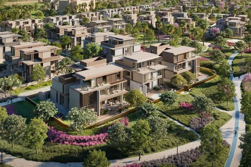 Render of detached villas at Nad Al Sheba Gardens set around planted gardens, with a cycle path and parkland running past