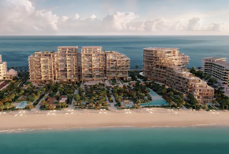 Aerial render of The Alba on the Palm Jumeirah beachfront, with terraced curved buildings above gardens and a private beach