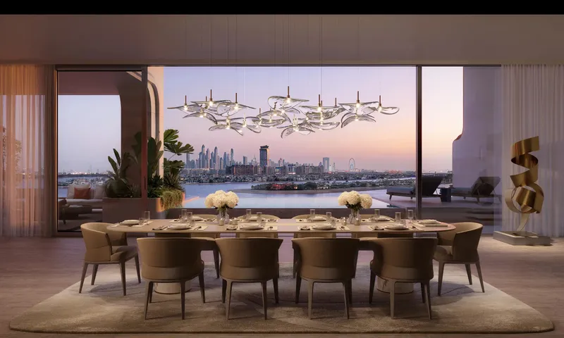 Dining room with a long table and a sculptural chandelier, with sea and skyline views at dusk