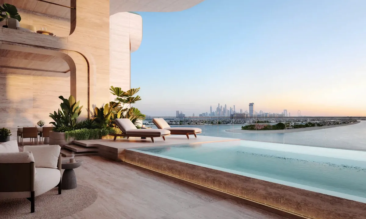 Terrace with a private pool and loungers looking across the sea to the Dubai skyline