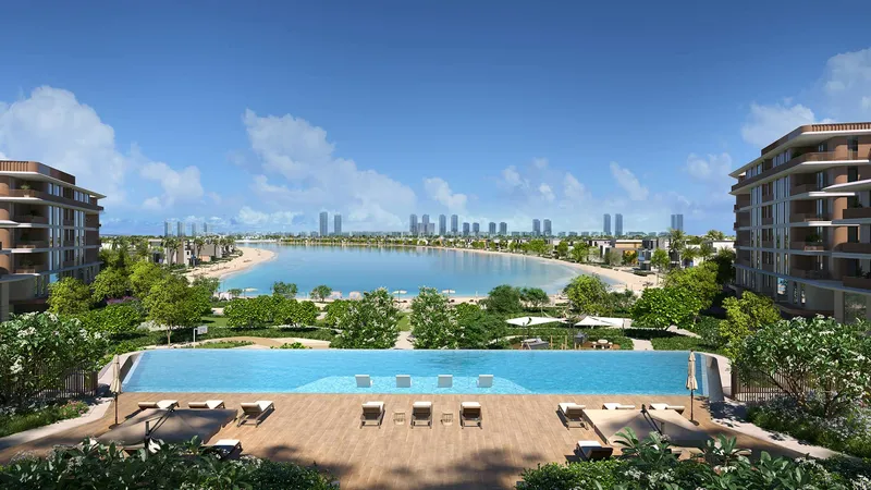 Infinity pool deck between the Palm Central Private Residences buildings, looking over the lagoon