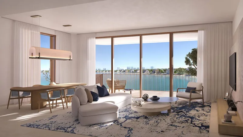 Living and dining area at Palm Central Private Residences opening onto a balcony