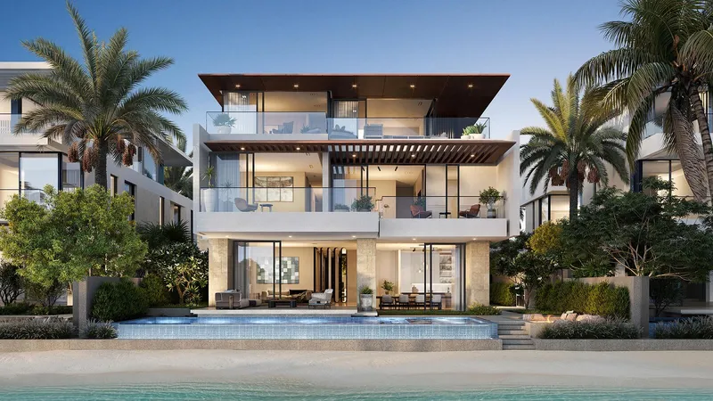 Ocean Whisper villa exterior seen from the beach, with the Arabian Gulf beyond