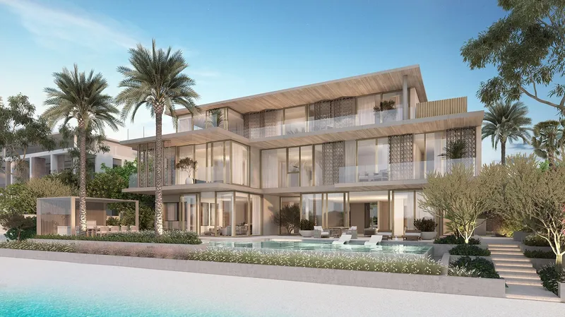 Redwood villa exterior from the beach, with the Arabian Gulf beyond