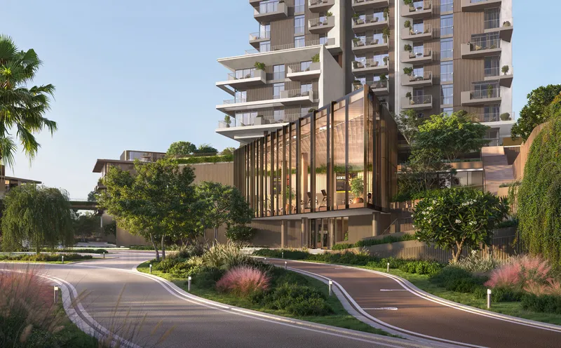 Render of a Rise by Athlon tower and a glass pavilion beside a curving cycle track and planting