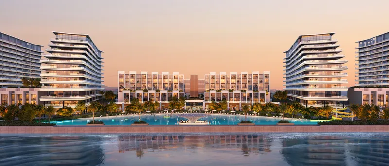River Cove Residences towers framing a lagoon pool at dusk in Sobha City, Abu Dhabi