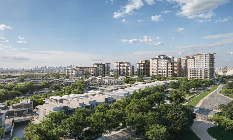 Aerial daytime render of the Expo Valley Views apartment cluster with villas in the foreground and the Dubai skyline on the horizon