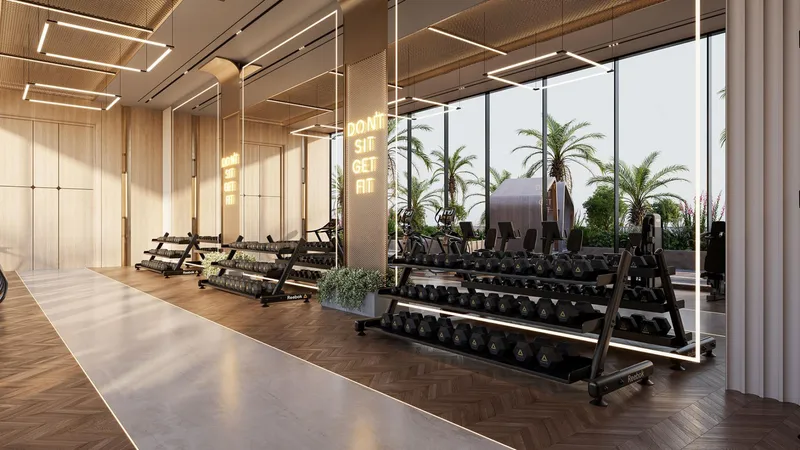 Render of the indoor gym at SAMANA Business Hub, with weight racks and windows onto palm trees