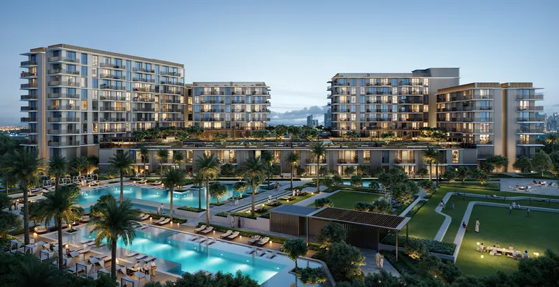 Aerial render of the Sera low-rise apartment buildings at dusk around pools, lawns and palm trees