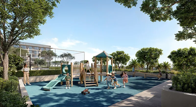 Render of children on a shaded play structure with slides in a landscaped play area