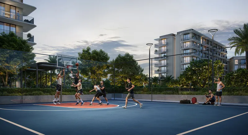 Render of residents playing on an outdoor basketball court beside the Sera buildings at dusk
