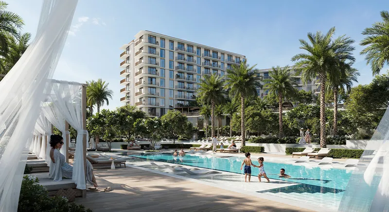 Render of a resident relaxing in a cabana beside a pool, with an apartment building and palms behind