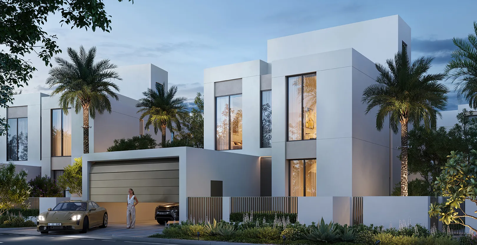 Render of white two-storey Serro 2 villas with garages and palm trees at dusk